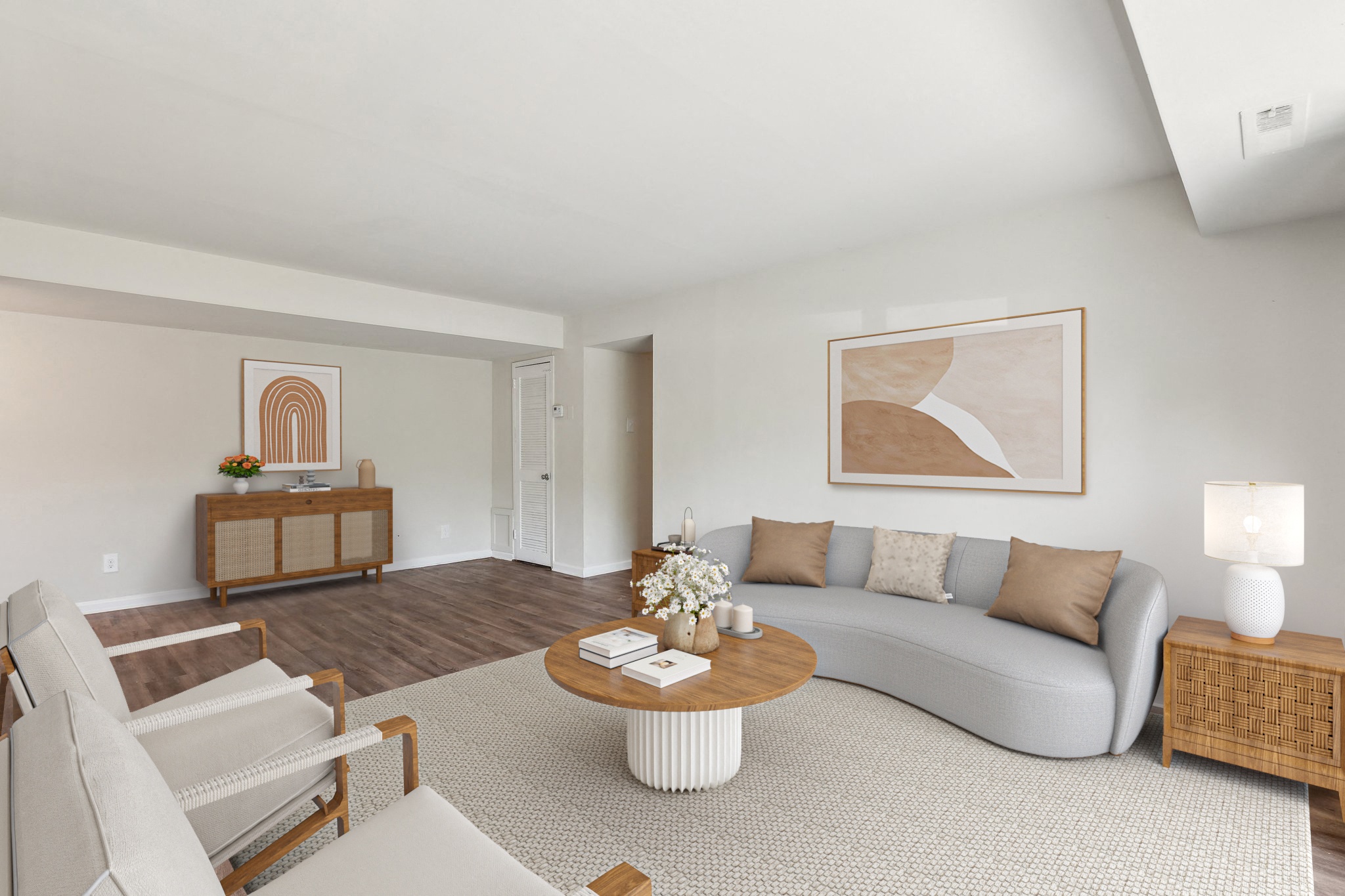 a living room with a gray couch and a coffee table